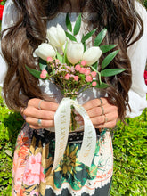 Load image into Gallery viewer, Mini flower bouquet with monogram ribbon being held by model
